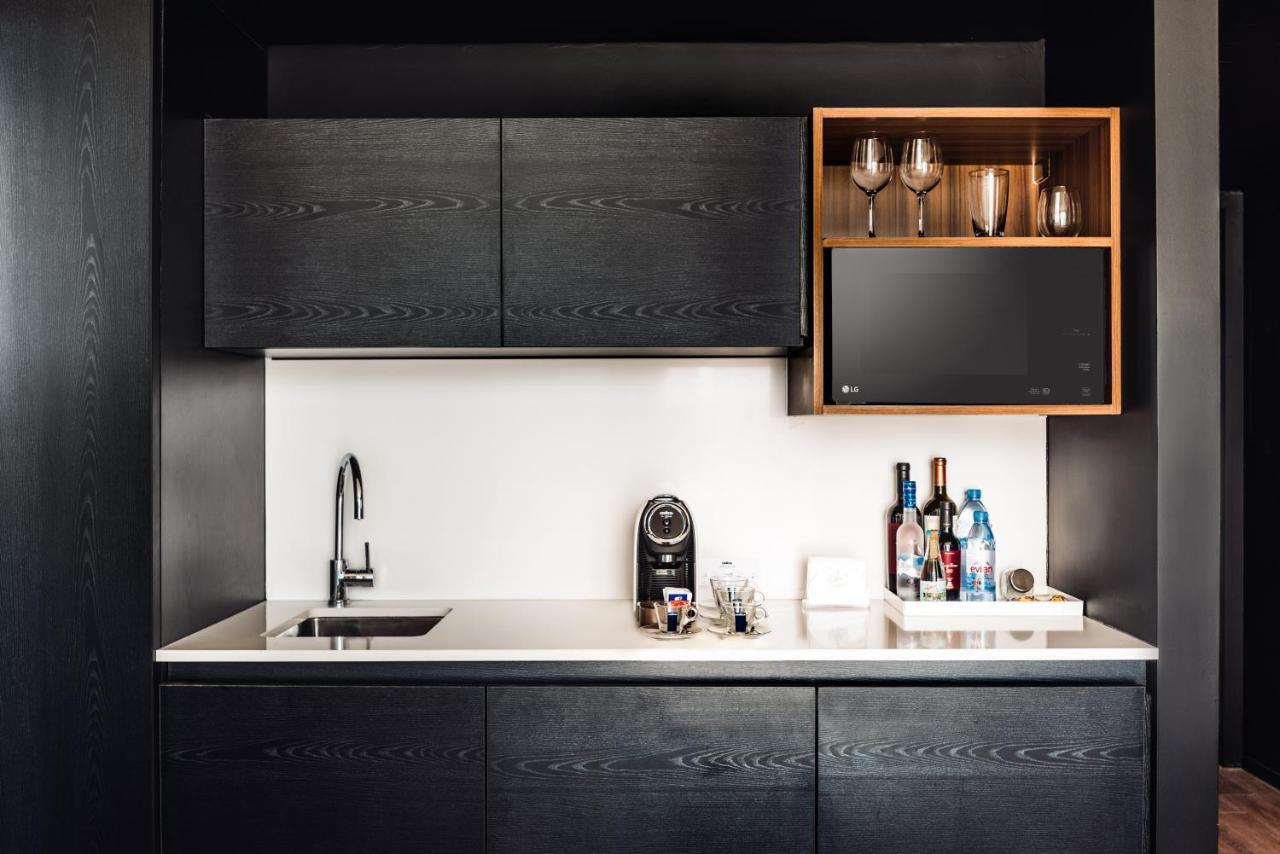 Hotel SLS Buenos Aires Puerto Madero Exterior foto A wet bar in a hotel room